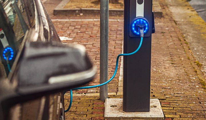Detail view of power supply for hybrid electric car on Automobile charge station on street of Amsterdam, Netherlands